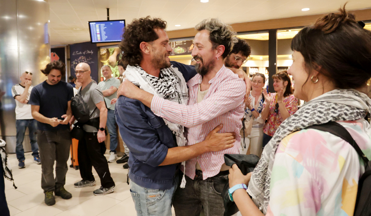 Activists are welcomed as they return from the Global Sumud Flotilla, at the Bologna airport, Italy, Saturday, May 23, 2026. (AP)