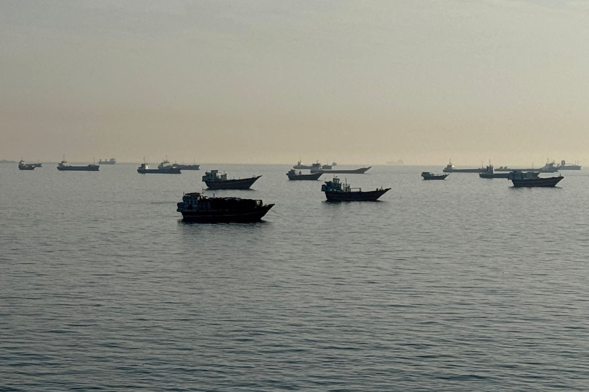 Vessels are seen anchored in the Strait of Hormuz, off the port city of Khasab on Oman’s northern Musandam Peninsula on May 17, 2026. (AFP)
