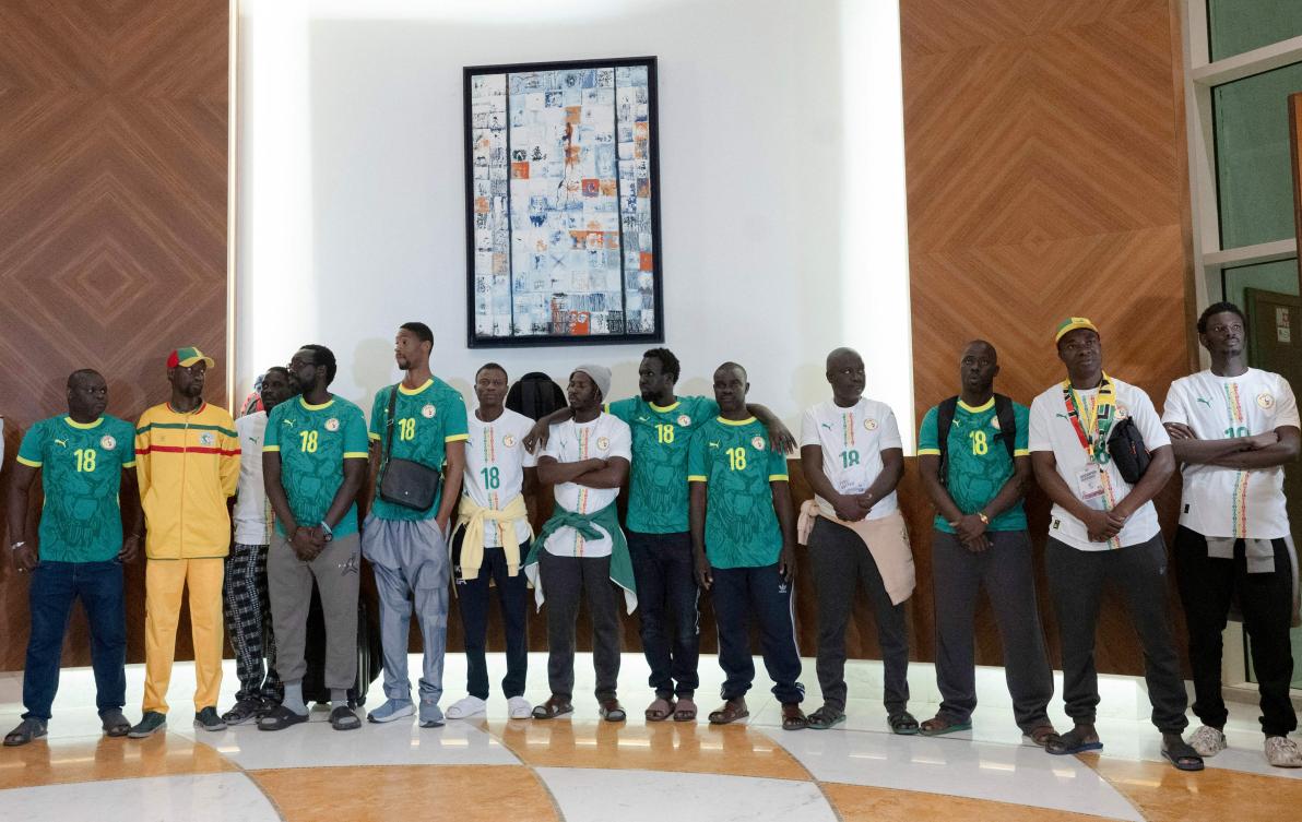 Senegalese supporters who were granted a royal pardon in Morocco arrive at Blaise Diagne International Airport in Ndiass, Senegal on May 24, 2026, after being held in Morocco since the Africa Cup of Nations final. (AFP)