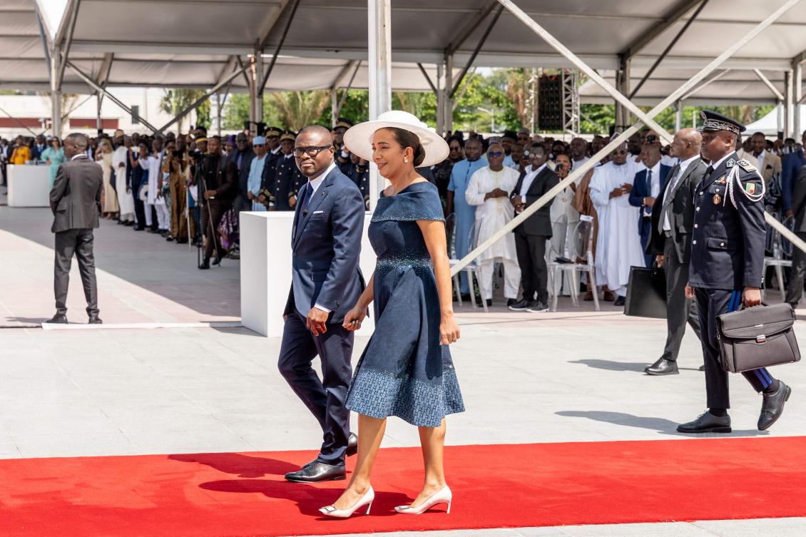 Benin’s president-elect Romuald Wadagni (C-L) and First Lady of Benin Nathalie Villette-Wadagni (C-R) arrive for the inauguration ceremony at the Palais des Congres in Cotonou on May 24, 2026. (AFP)