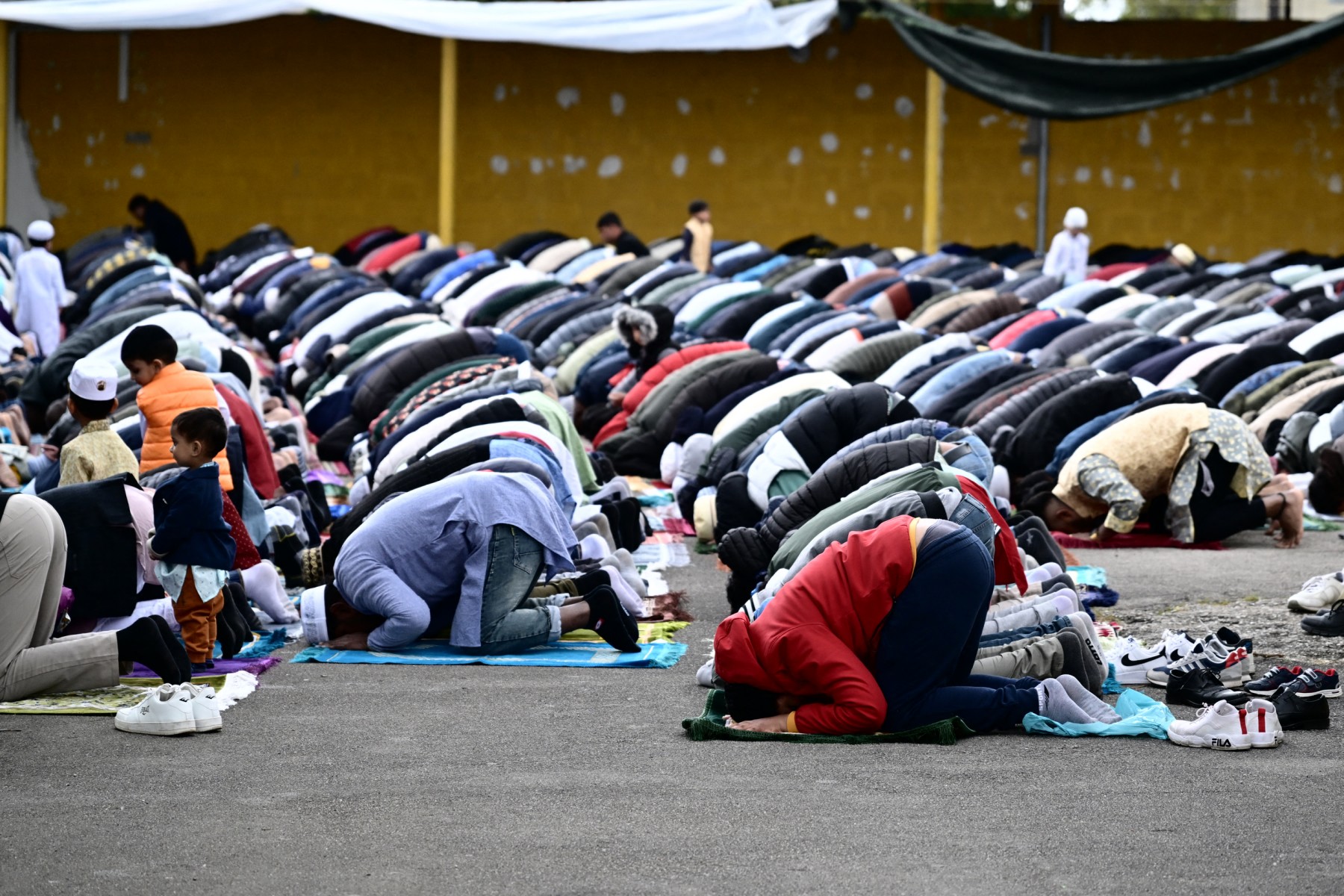 Muslims gather on the private parking lot of a construction site for the half-day prayer in Monfalcone, on April 26, 2024. (AFP)