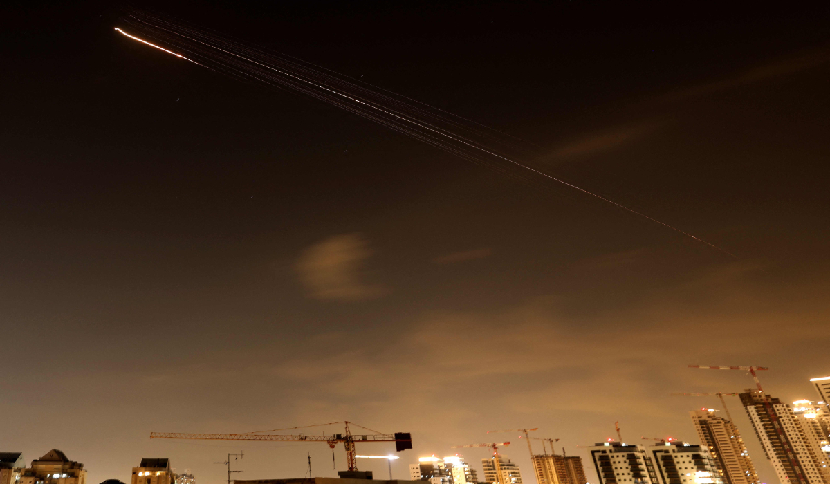 Rocket trails are seen in the sky above the Israeli coastal city of Netanya, amid a fresh barrage of Iranian missile attacks on March 27, 2026. (AFP)