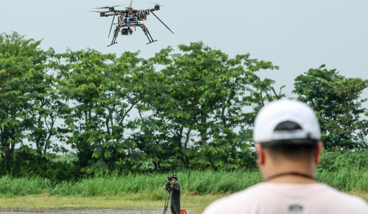 This picture taken on October 16, 2024 shows a student operating a multirotor drone during the Second National Defense Application of the unmanned aerial vehicle (UAV) Challenge in Chiayi. (AFP)