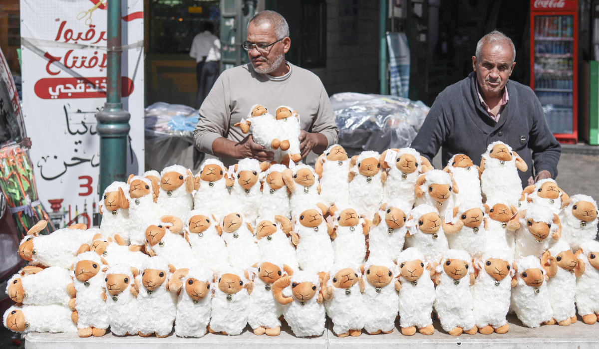 A vendor displays stuffed sheep toys outside his shop in Nablus on Tuesday. (AFP)