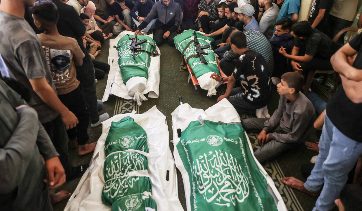 Mourners gather prior to the burial of Hamas leader Mohammed Odeh and other Palestinians during their funeral in Gaza City on Wednesday. (AFP)