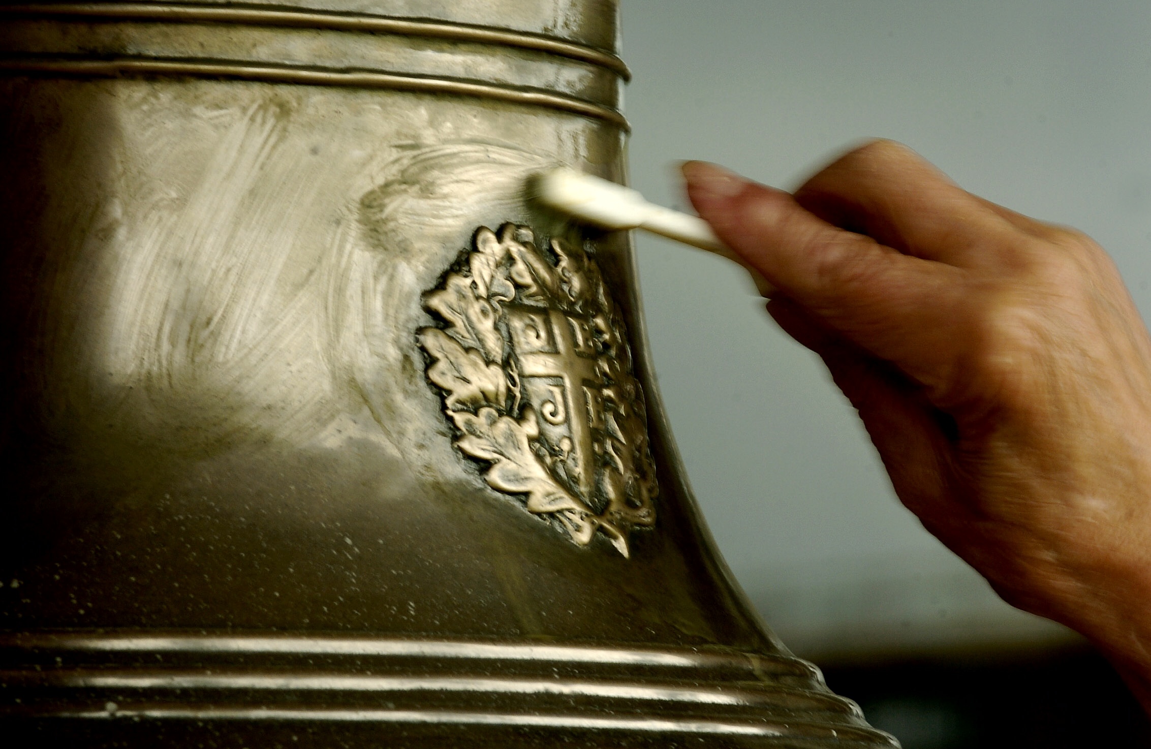 Above, Lancashire County Cricket Club’s pavilion bell is cleaned on June 15, 2004. (Action Images/AFP)