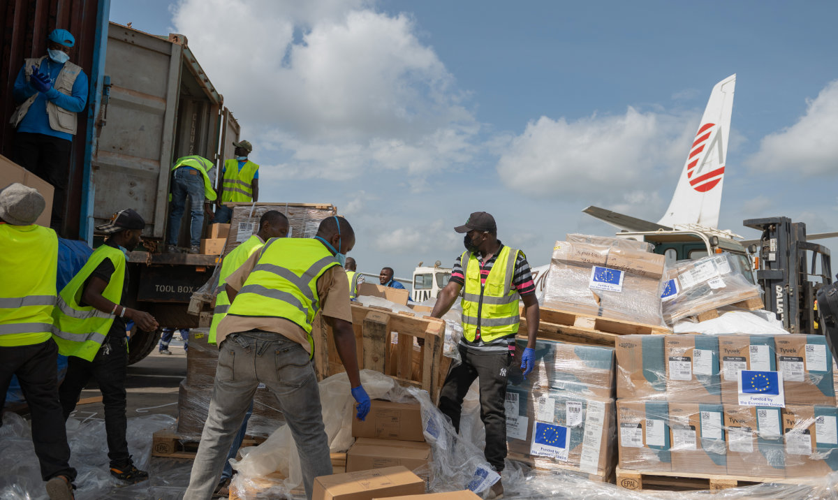 Workers offload medical and emergency supplies donated by EU to support frontline workers in fighting Ebola upon arrival at the national airport in Bunia, Congo. (AP)