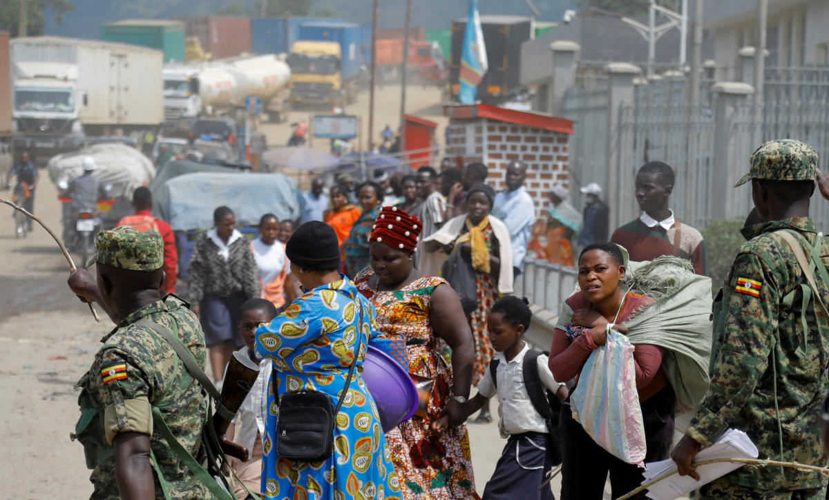 Members of Uganda People’s Defense Force direct people, after Uganda closed its borders with the Democratic Republic of Congo, as authorities intensify efforts to contain a new Ebola outbreak caused by the Bundibugyo virus strain, at the Mpondwe border post, in Kasese district, Uganda, May 28, 2026. (Reuters)