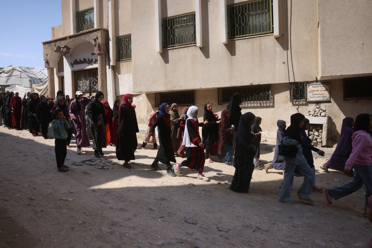 Some of the 470 Palestinian girls and young women arrive to attend a Quran recitation circle at the Al-Nour Quran Memorization Center in Khan Yunis, Gaza. (AFP)
