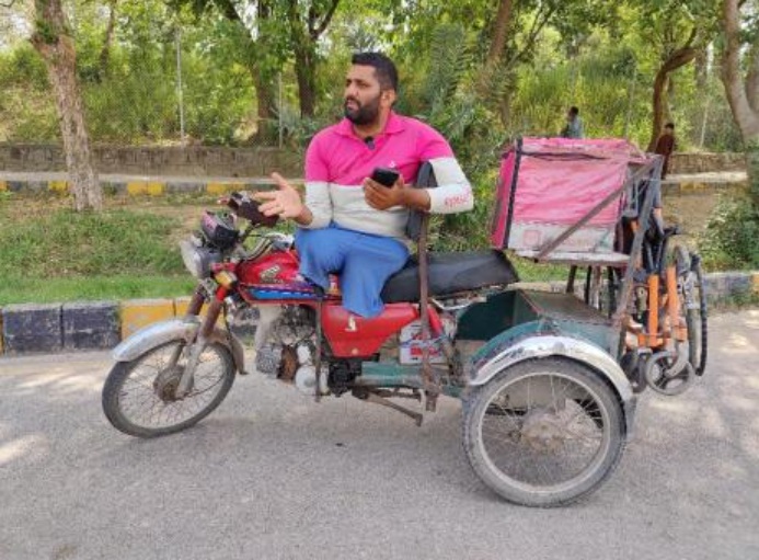 For Pakistani food rider who lost both legs, Eid homecoming crowns year of struggle