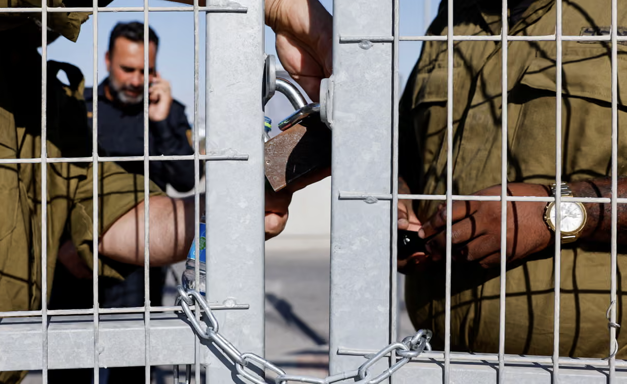 Israeli soldiers lock a gate at Sde Teiman detention facility, where a rare attempt to prosecute the alleged perpetrators of the 2024 rape of a Palestinian man failed. (Reuters/File Photo)