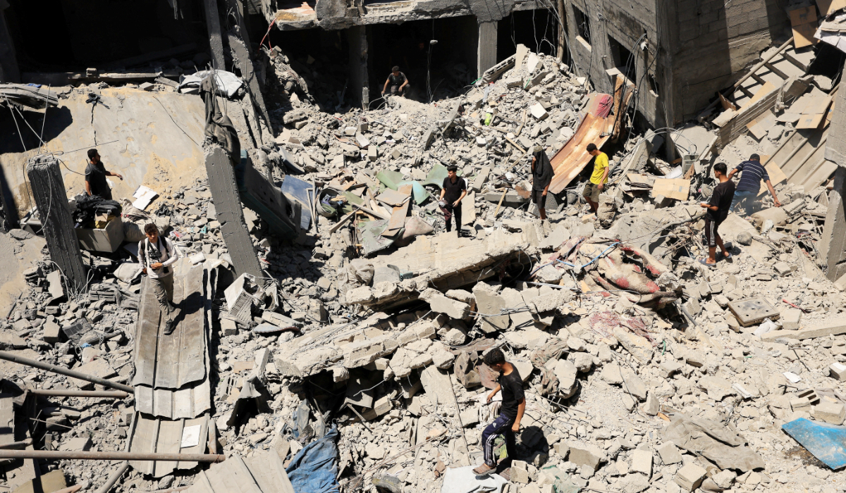 Palestinians inspect the site of an Israeli strike on a house that was pre-warned by the Israeli military to evacuate, before the strike was carried out late on Thursday at Shati (Beach) refugee camp, in Gaza City, May 29, 2026. (REUTERS)