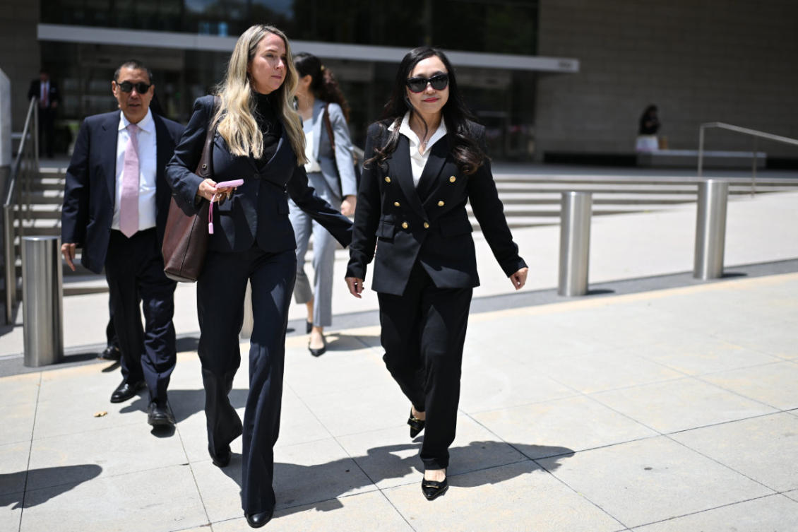 Eileen Wang, the former mayor of Arcadia, Calif.ornia, at right, exits federal court after pleading guilty on charges of acting as an illegal agent for the Chinese government on Friday, May 29, 2026, in Los Angeles. (AP Photo/William Liang)