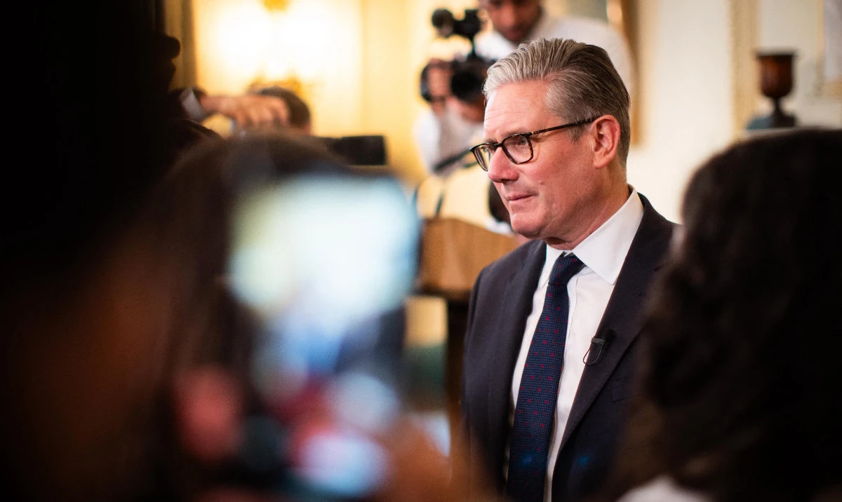 Britain's Prime Minister Keir Starmer speaks to guests during a reception at 10 Downing Street in London on May 19, 2026. (AFP)