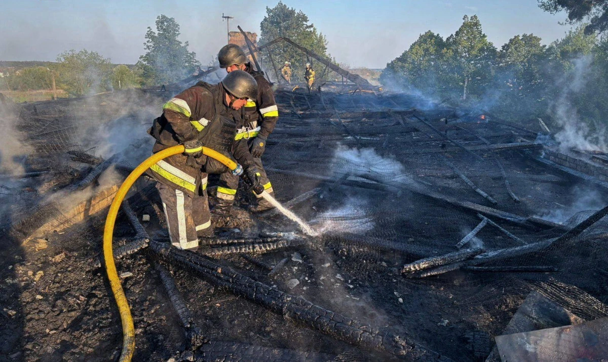 Firefighters work at the site of a kindergarten damaged during a Russian drone strike, amid Russia's attack on Ukraine, in Kyiv region, Ukraine May 12, 2026. (Reuters)