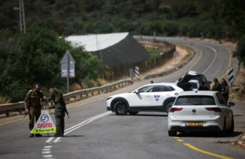 Soldiers set up a roadblock on the road leading to the tourist site of Rosh HaNikra in northern Israel, following a drone strike from Lebanon that injured three Israeli civilians according to the Israeli military, May 14, 2026. (Reuters)