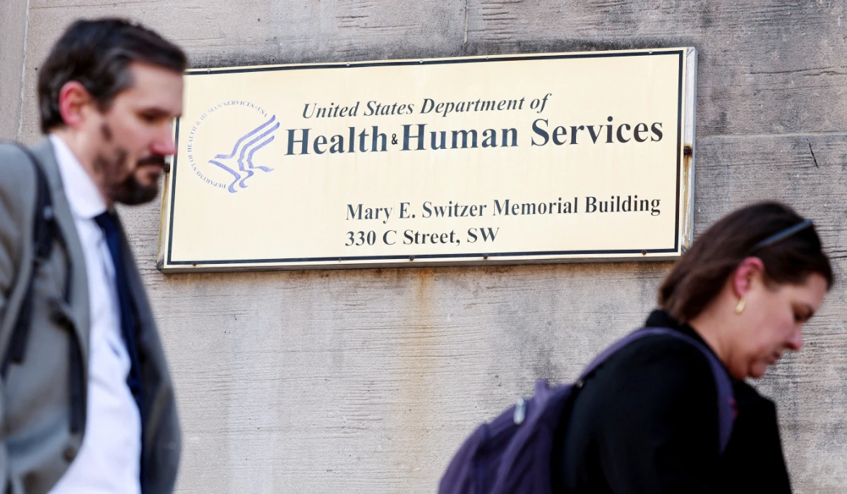 Employees of the Department of Health and Human Services (HHS) stand outside the Mary E. Switzer Memorial Building in Washington, D.C., U.S., April 1, 2025. (REUTERS)