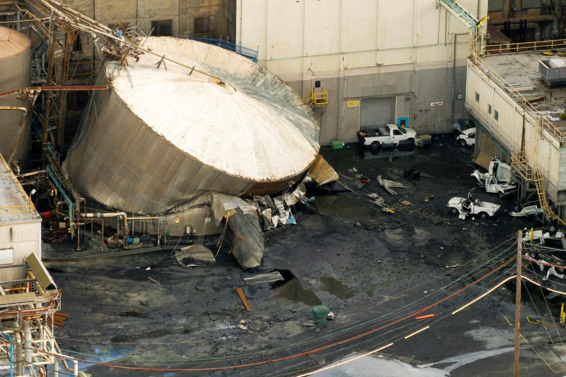 The accident at the Nippon Dynawave Packaging Company happened during an early morning shift change when a 900,000-gallon tank containing a large quantity of a substance called white liquor ruptured. (Reuters)