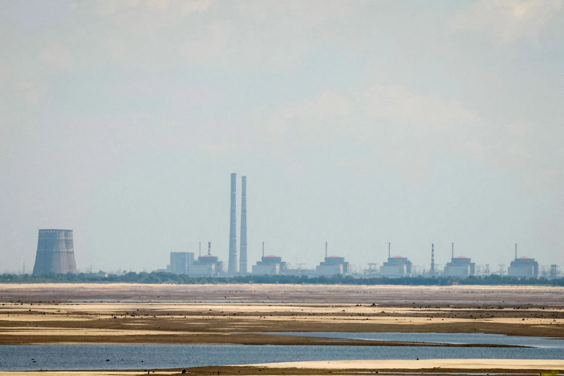 FILE PHOTO: A view shows Zaporizhzhia Nuclear Power Plant from the bank of Kakhovka Reservoir near the town of Nikopol after the Nova Kakhovka dam breached, amid Russia's attack on Ukraine, in Dnipropetrovsk region, Ukraine June 16, 2023. (Reuters)