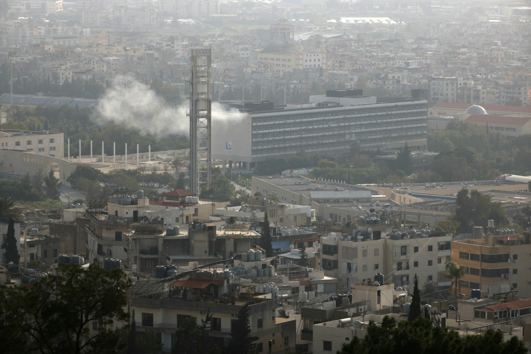 FILE PHOTO: Smoke rises after an Israeli strike targeted a campus of the Lebanese University, killing two academics, in the Hadath neighbourhood of Beirut on March 12, 2026. (AFP)