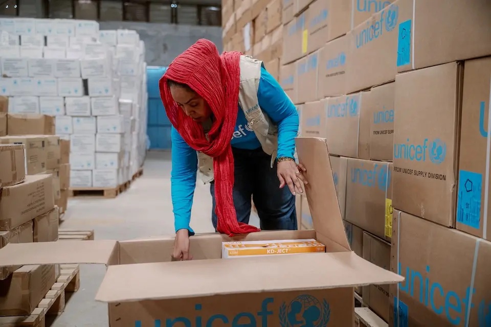 A logistics officer checks supplies headed for Sudan from a UNICEF supply hub in Denmark. (UNICEF/File)