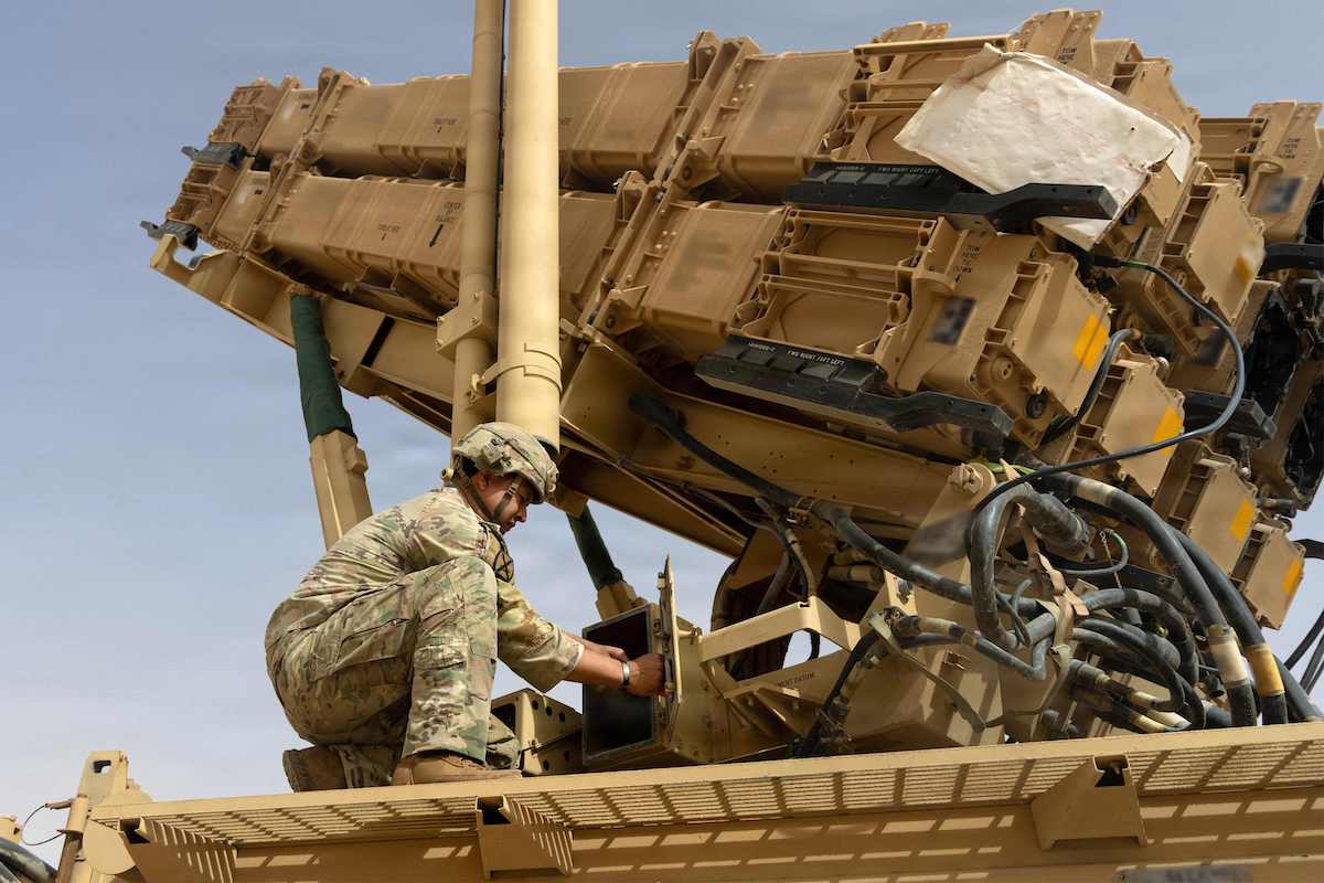A US Army air defense artilleryman conducts maintenance on an MIM-104 Patriot missile system at an undisclosed location in the Middle East. (US Army/AFP)