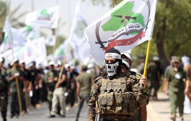 Asaib Ahl Al-Haq members participate in a Quds Day march in Baghdad, Iraq, Friday, July 1, 2016. (AP Photo)