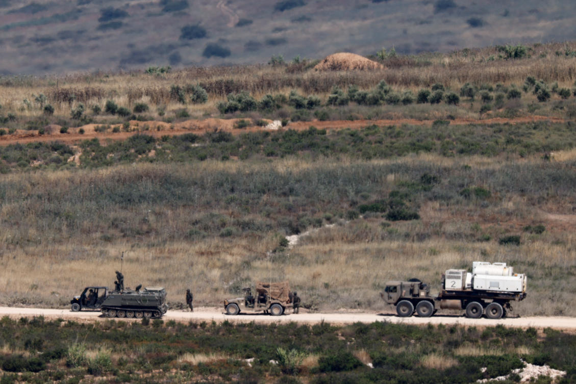 Above, Israeli soldiers near military vehicles in Lebanon on June 1, 2026. (Reuters)