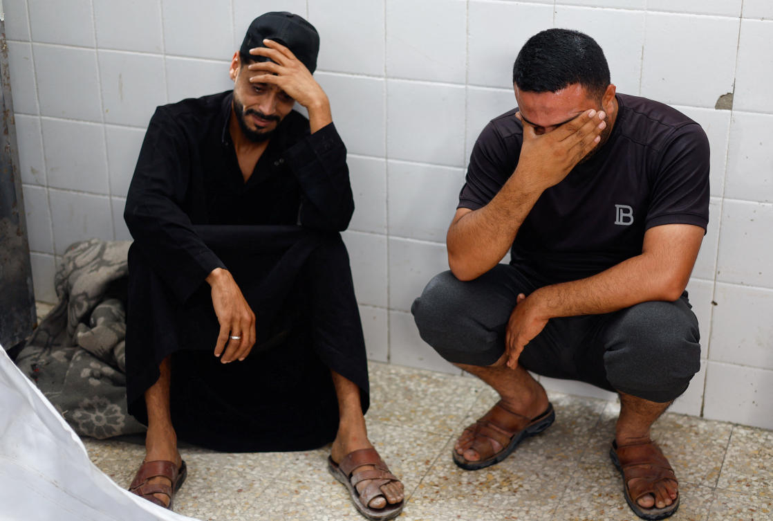 Mourners react during the funeral of brothers Saqer and Moumen Al-Aydi, who were killed in an Israeli strike, according to medics, at Al-Aqsa Martyrs Hospital in Deir al-Balah, in the central Gaza Strip, June 3, 2026. (Reuters)