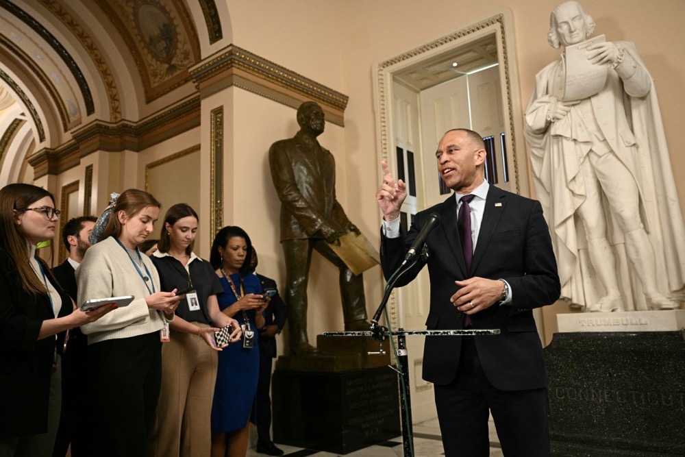 US House Minority Leader Hakeem Jeffries, Democrat of New York, speaks to reporters. (AFP)