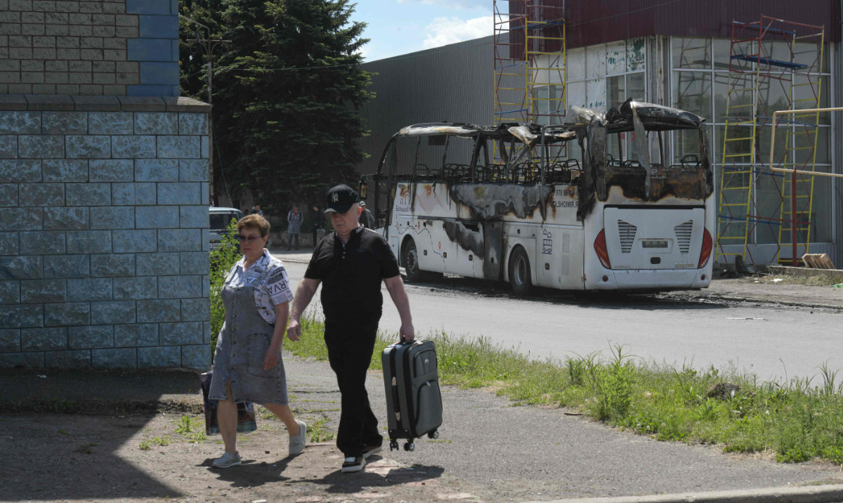A view shows the site of a drone strike on a bus in the settlement of Yenakiyeve in the Donetsk region, Russian-controlled Ukraine, on June 3, 2026, amid the ongoing Russian-Ukrainian conflict. (AFP)