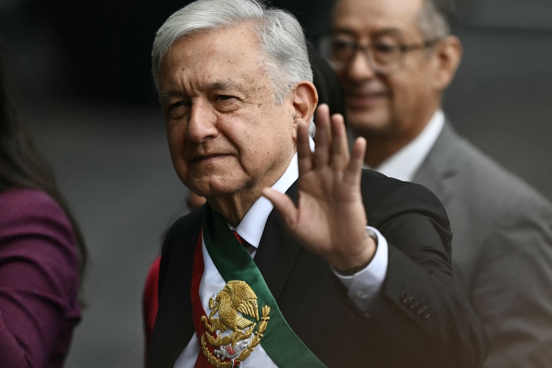 Outgoing Mexican President Andres Manuel Lopez Obrador waves upon arrival at the inauguration ceremony of Mexico's President-elect Claudia Sheinbaum at the Congress of the Union in Mexico City. (AFP)