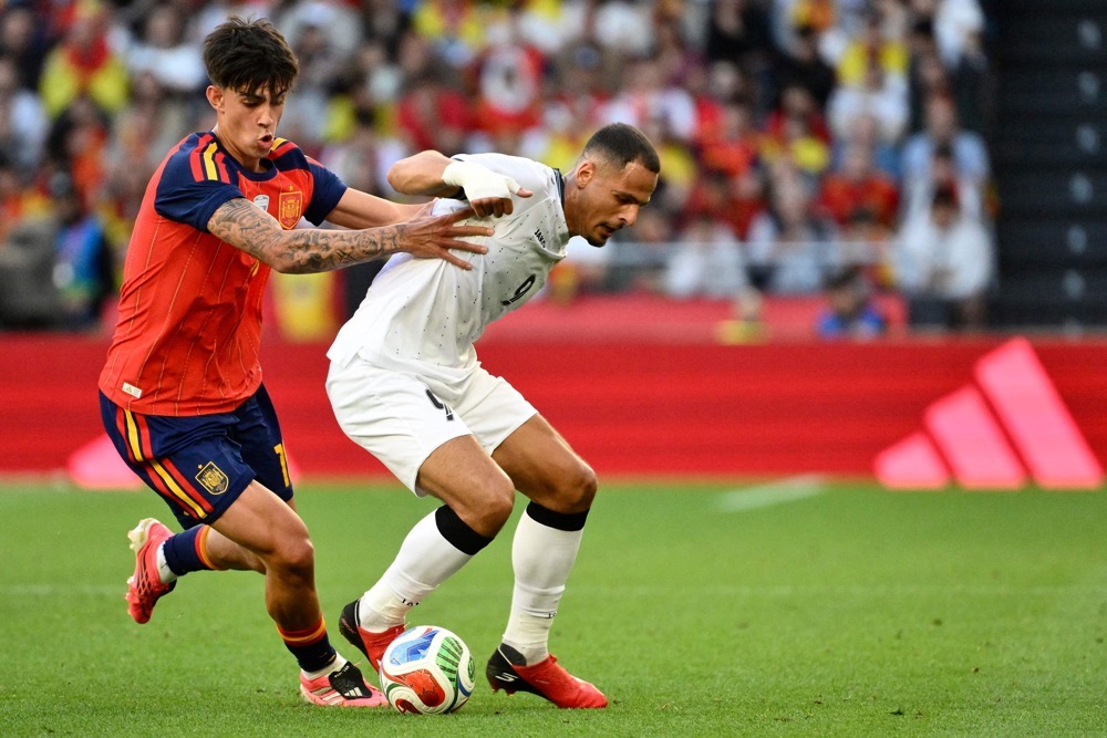 Second-string Spain held by Iraq in low-key World Cup send-off