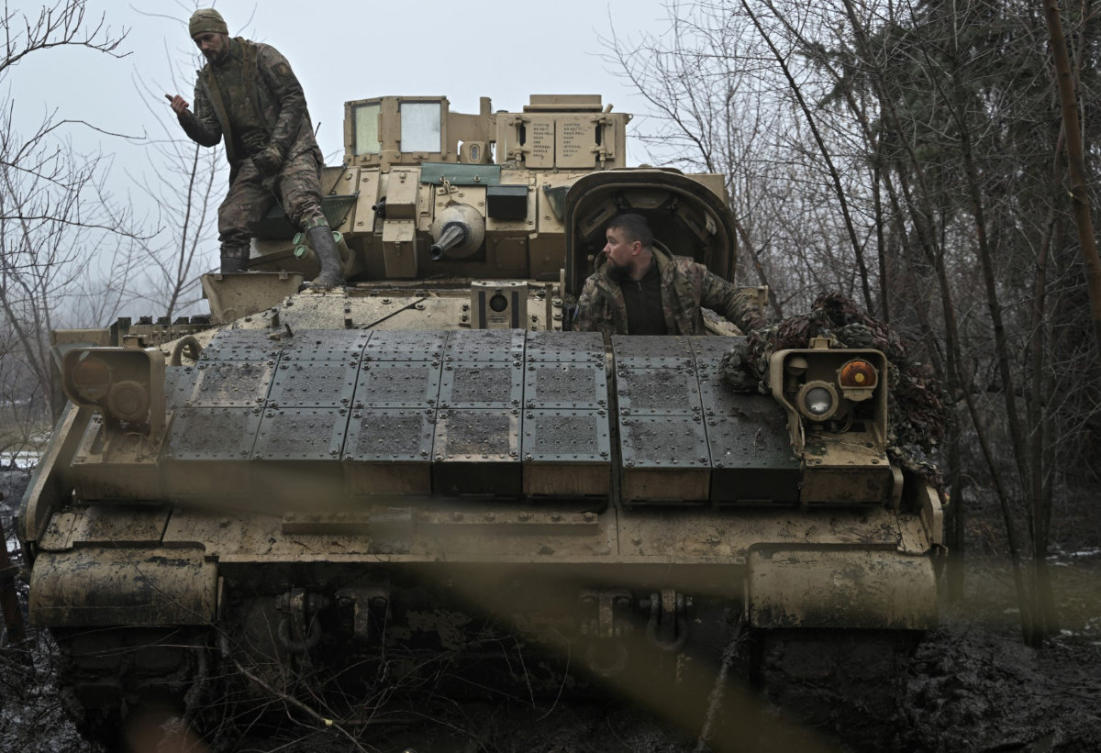 In this photo taken on February 11, 2024, Ukrainian servicemen prepare for combat a Bradley fighting vehicle, not far away from Avdiivka, Donetsk region, amid the Russian invasion of Ukraine. (AFP/File)