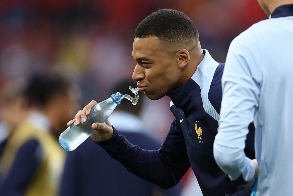 FIFA has reacted to expected heat in some outdoor stadiums by enforcing three-minute drinks breaks midway through each half at all games. (AFP/File)