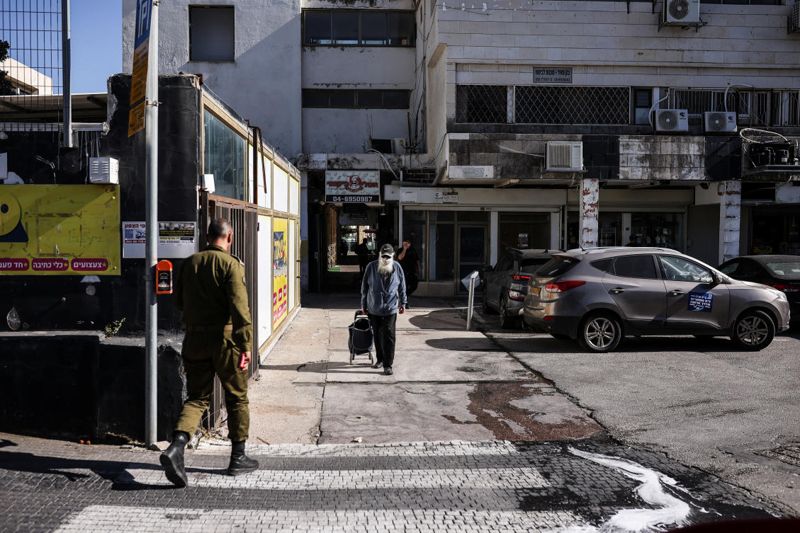 An Israeli soldier crosses a road in Kiryat Shmona, northern Israel, June 2, 2026. (REUTERS)