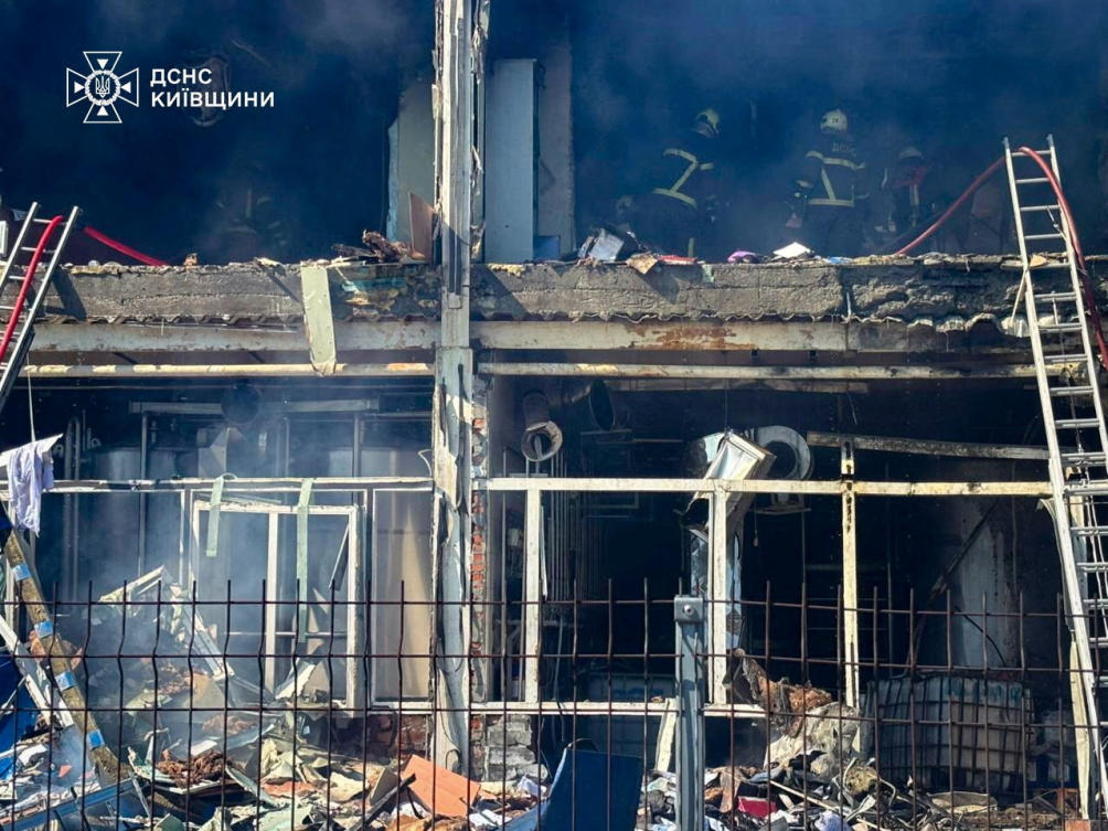 Rescuers work at a site of a dairy plant hit by a Russian drone strike in Kyiv region, Ukraine in this handout picture released June 5, 2026. (State Emergency Service of Ukraine in Kyiv region via Reuters)