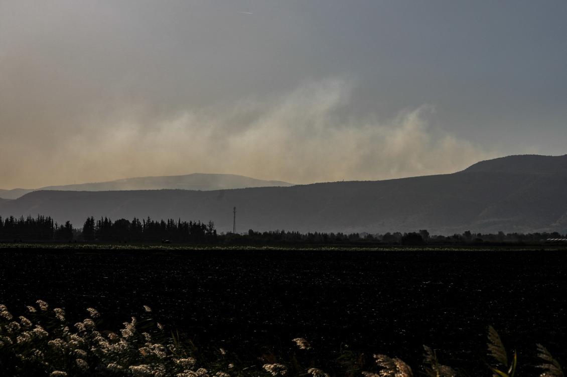 Above, smoke billows from Ramim Ridge in the Upper Galilee after an exchange of fire between Israel and the Lebanese Hezbollah movement near Yiftah on Israel’s border with Lebanon on Nov. 5, 2023. (AFP file photo)