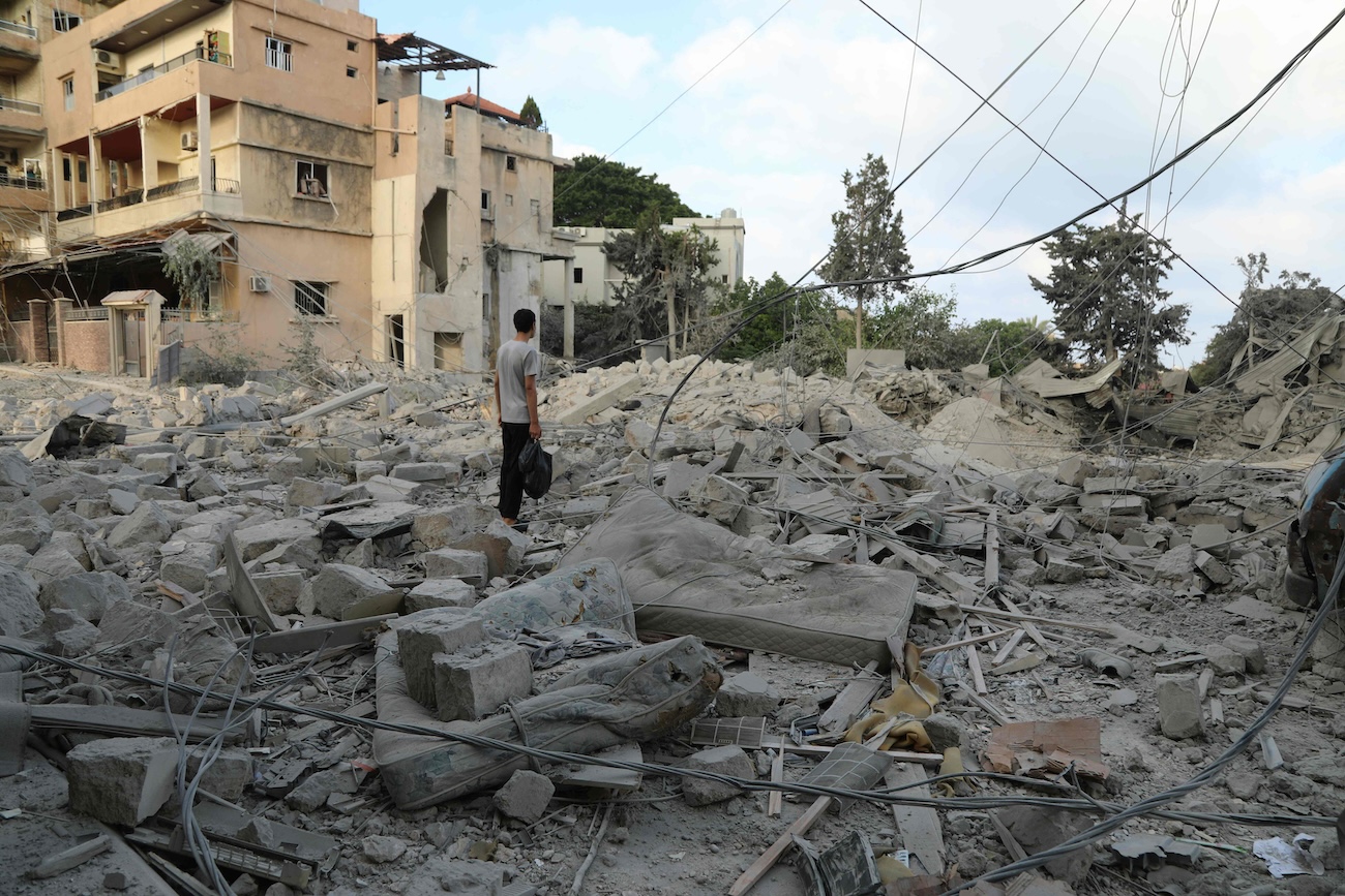 A man stands amid debris following Israeli airstrikes that hit the previous day, near the archaeological site of the Roman hippodrome in the southern Lebanese city of Tyre on June 8, 2026. (AFP)