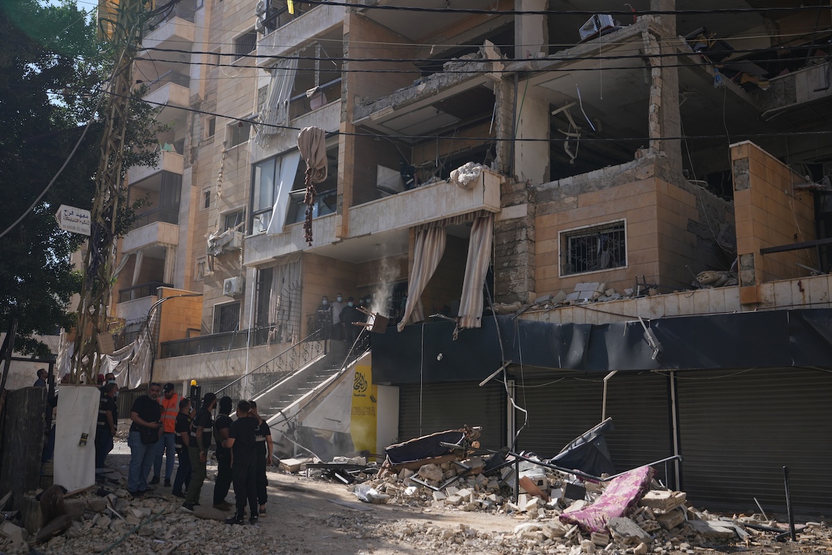 Lebanese security officers gather at the site where an Israeli airstrike hit a building in Dahiyeh, Beirut’s southern suburb on June 7, 2026. (AP)