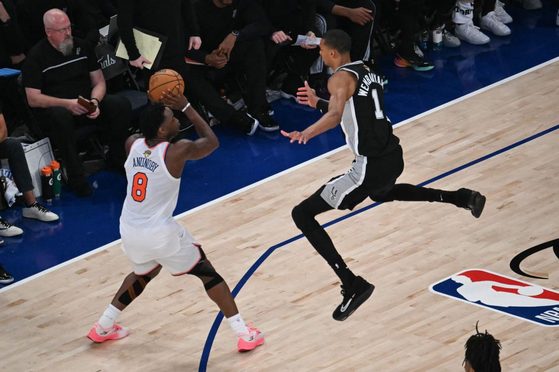 San Antonio Spurs’ French forward-center Victor Wembanyama jumps as Knicks’ British-US player OG Anunoby prepares to throw during Game Three of the NBA Finals, Madison Square Garden, New York, June 8, 2026. (AFP)