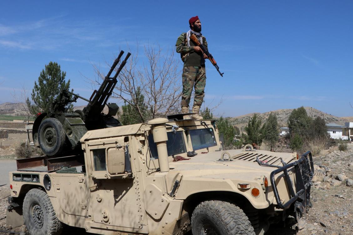 Above, a Taliban security personnel stands guard near an anti-aircraft gun while keeping watch for Pakistani airstrikes in the Tere Zayi district of Khost province on March 2, 2026. (AFP file photo)
