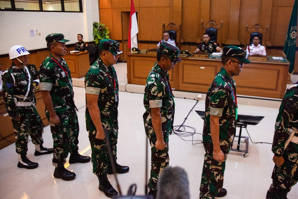 Military personnel (from 2nd L-R) Sergeant Second Class Edi Sudarko, Lieutenant First Class Budhi Hariyanto Widhi Cahyono, Captain Nandala Dwi Prasetya, and Lieutenant First Class Sami Lakka, accused of throwing acid at human rights activist Andri Yunus attend a trial at a military court in Jakarta on April 29, 2026. (AFP)