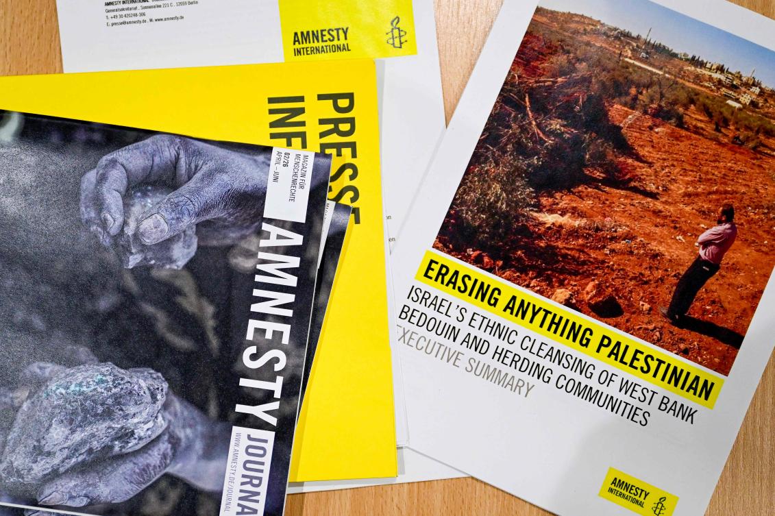 Press material and Amnesty International’s report, ‘Erasing anything Palestinian: Israel’s ethnic cleansing of West Bank Bedouin and herding communities’ at a press conference of Amnesty International in Berlin on June 10, 2026. (AFP)