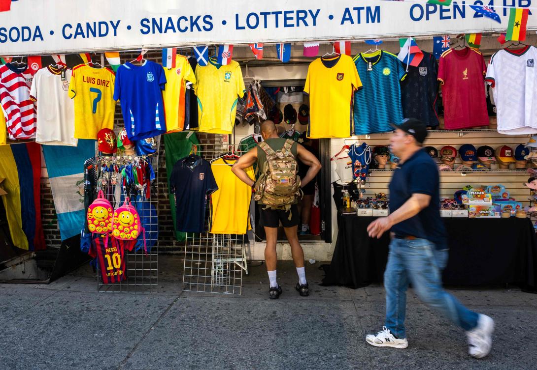Businesses prepare for the World Cup by displaying flags, football shirts, and banners in the Queens borough of New York City. (AFP)