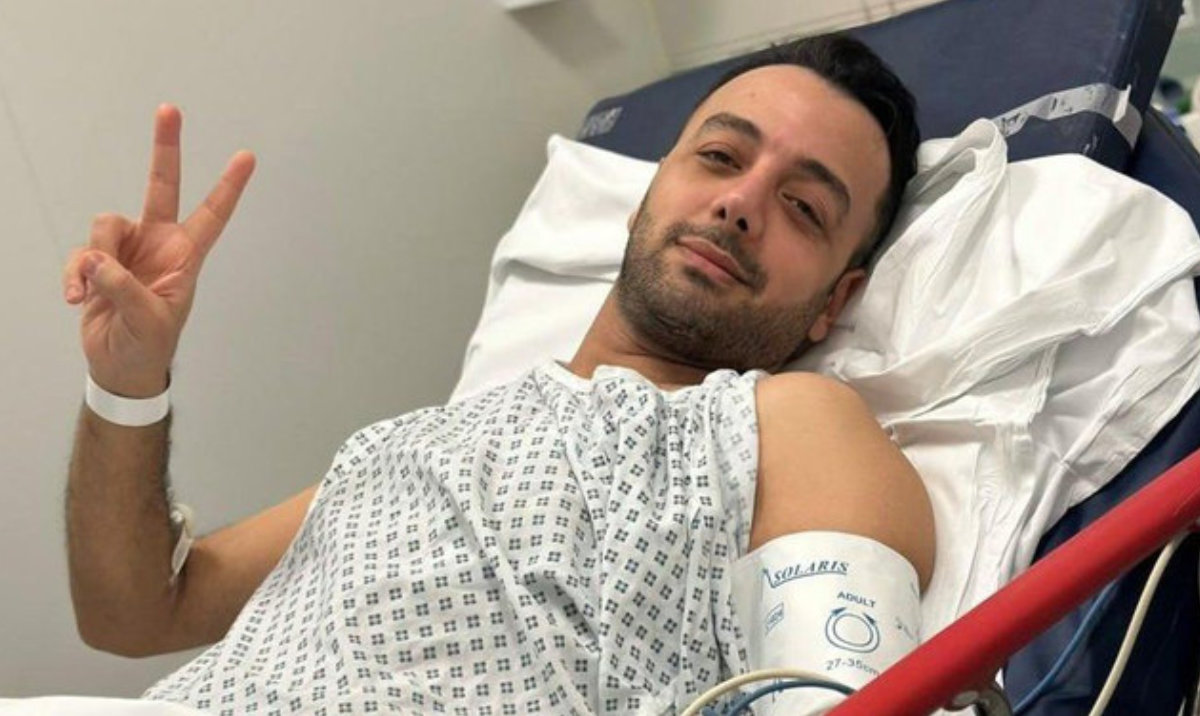Iranian-British Pouria Zeraati, above, was stabbed outside his home in Wimbledon on March 29, 2026 by two Romanian men in an attack prosecutors said was ordered by the Iranian state. (Supplied)