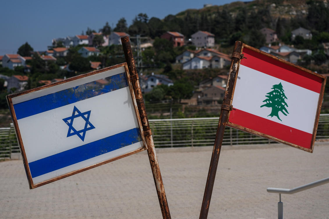Israel and Lebanon flags at a South Lebanon Army memorial at the Good Fence crossing in Metula, northern Israel. (Reuters)