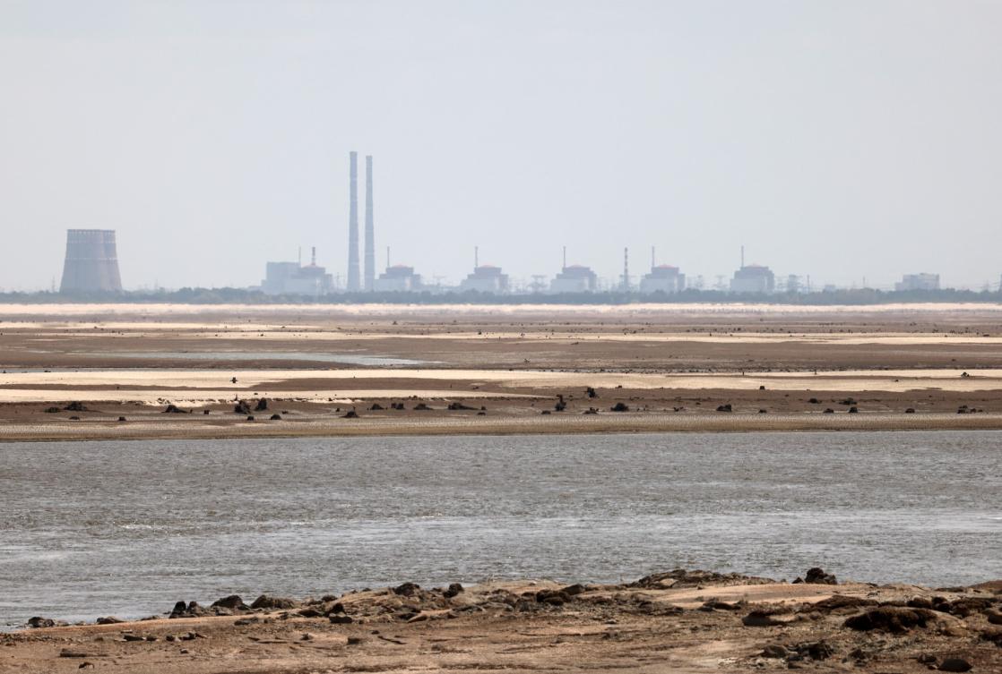This photograph taken from Ukrainian city of Nikopol on July 7, 2023, shows the Zaporizhzhia nuclear power plant, which is under Russian control since the first days of the Russian invasion of Ukraine. (File/AFP)