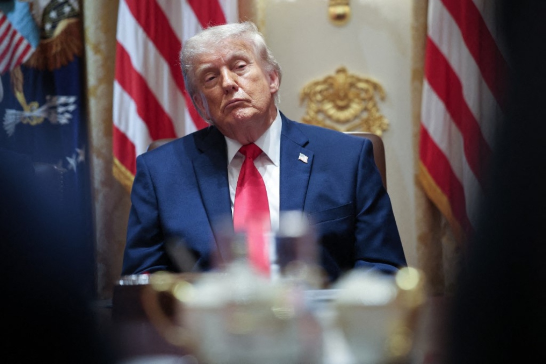 US President Donald Trump listens to members of his Cabinet speak during a meeting in the Cabinet Room of the White House, Washington, US. (AFP)