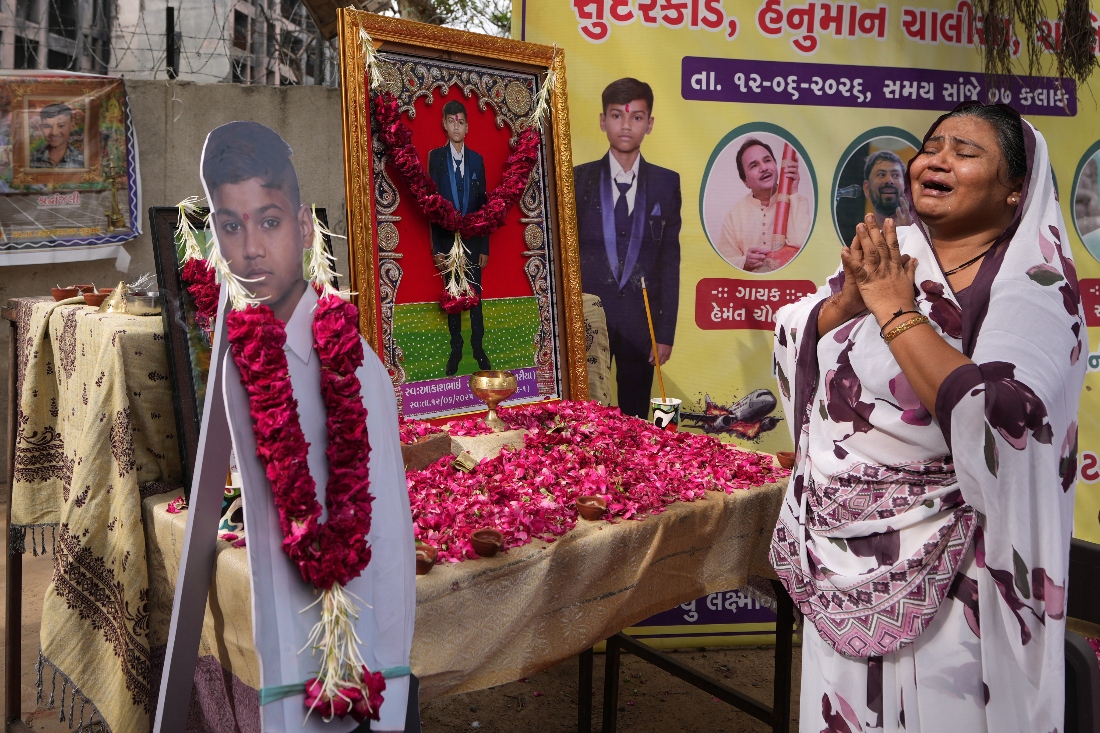 Sitaben Patni, survivor and mother of Akash Patni, who was killed the 2025 Air India plane crash, cries after paying tribute at the crash site on the first anniversary in Ahmedabad, India. (AP)